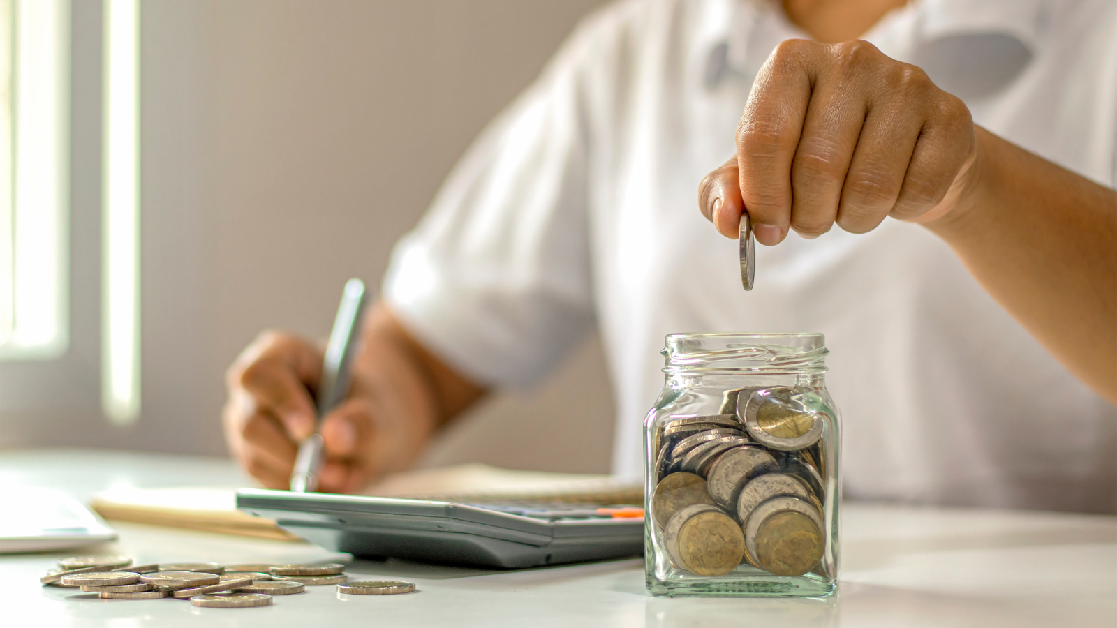 Someone working out finances at desk