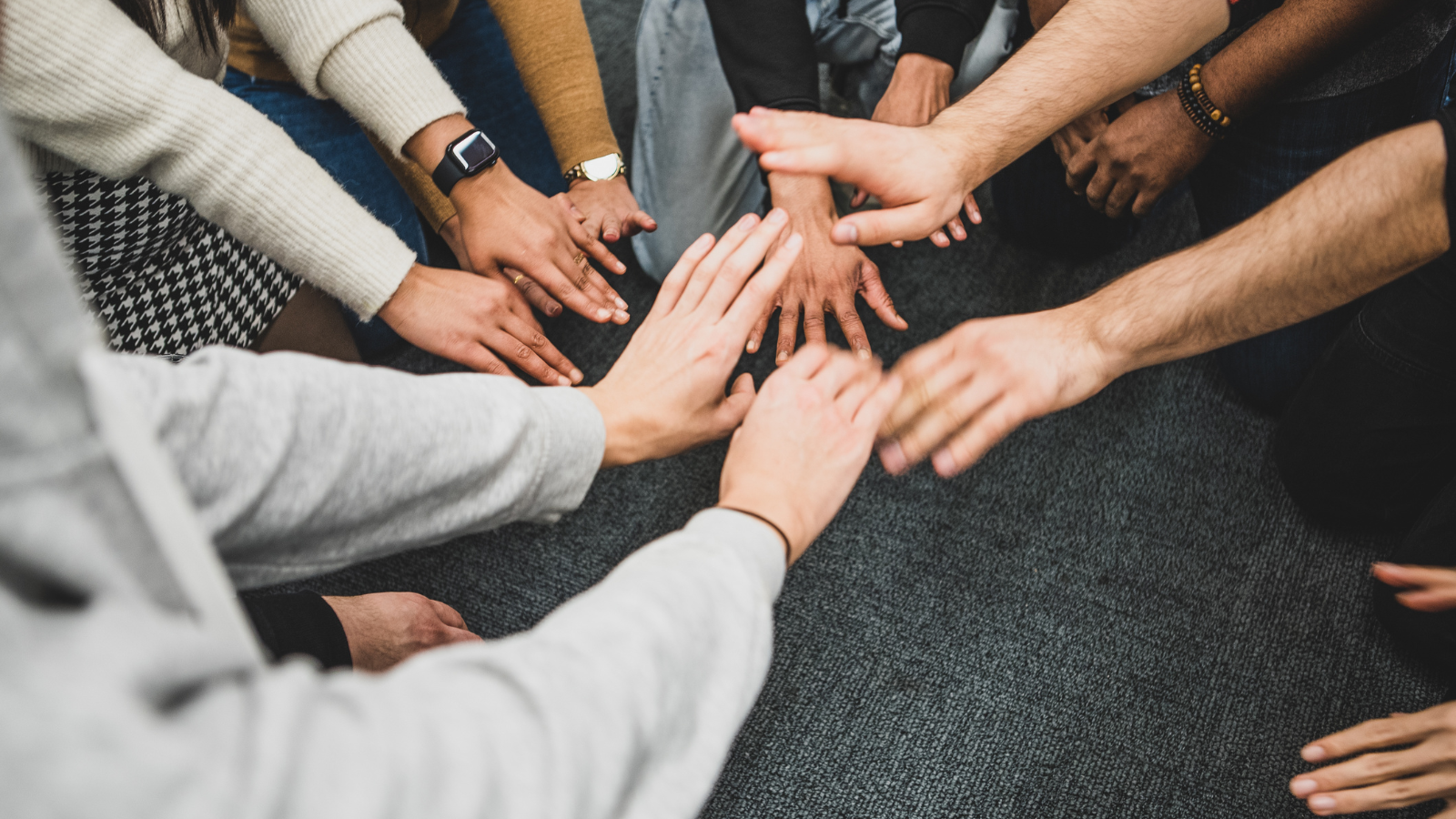 Hands in the middle for teamwork