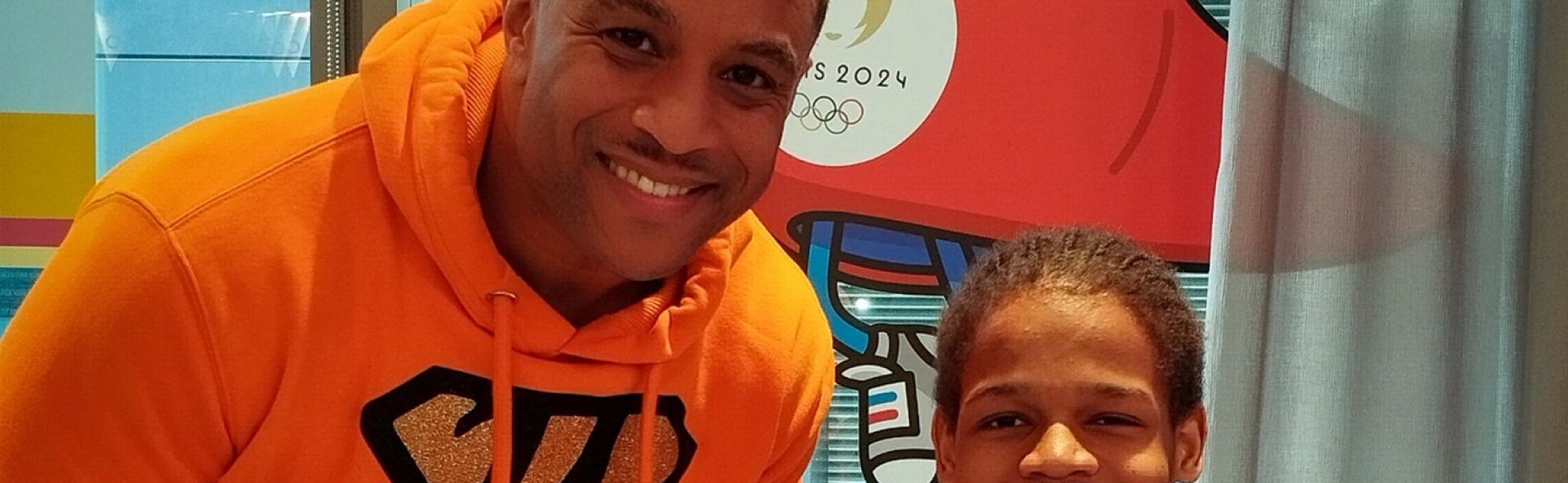 Julian standing next to a kid