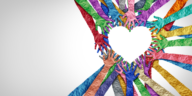 Image of multi-coloured hands forming a heart