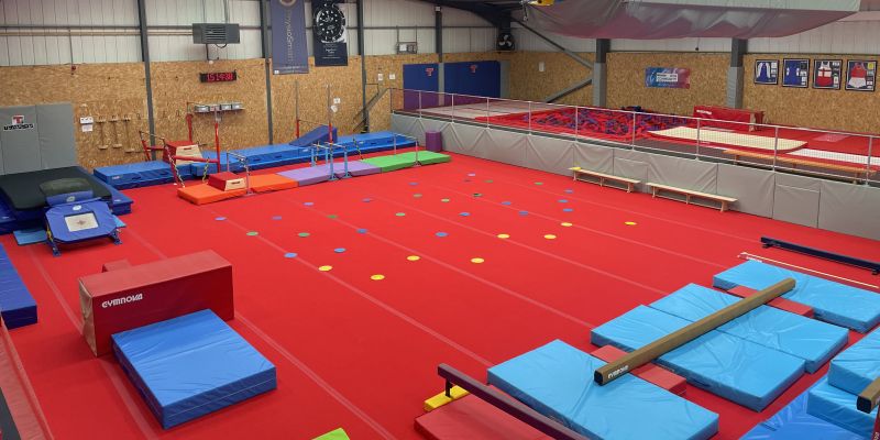 An image showing an hall full of gymnastics equipment