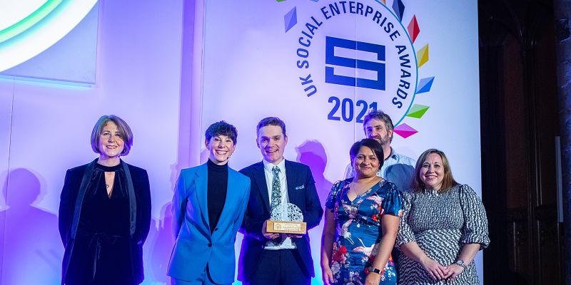 SIB and BSC members accepting the social investment deal of the year award