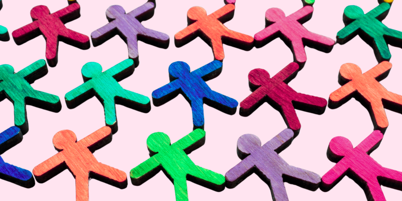 Image shows colourful stick figures on a pink background