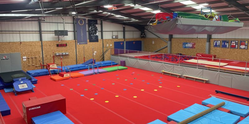 An image showing an hall full of gymnastics equipment