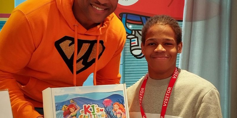 Julian standing next to a kid